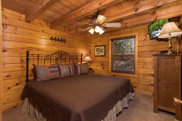 Master bedroom at Hooked on Cowboys Lodge, a 2 bedroom cabin rental located in Pigeon Forge