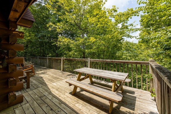 Uncovered picnic table at Hooked on Cowboys Lodge, a 2 bedroom cabin rental located in Pigeon Forge