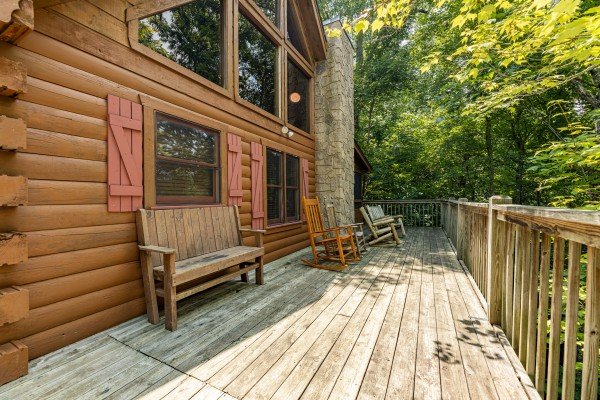 Deck seating at Hooked on Cowboys Lodge, a 2 bedroom cabin rental located in Pigeon Forge