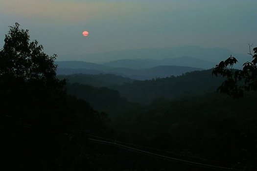 View of moonlit mountain range of the Smoky Mountains seen from Big Bear Lodge, a 7-bedroom cabin rental located in Gatlinburg