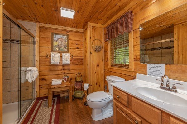 Bathroom with a glass shower at Bearfoot Adventure, a 2 bedroom cabin rental located in Gatlinburg