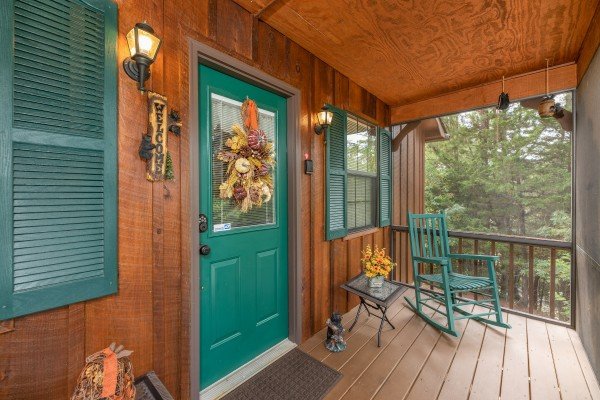 Rocking chair at the front door at Black Bear Holler, a 2 bedroom cabin rental located in Pigeon Forge