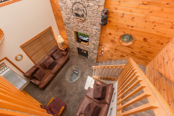 Looking down at the living room at Stones Throw, a 4 bedroom cabin rental located in Pigeon Forge
