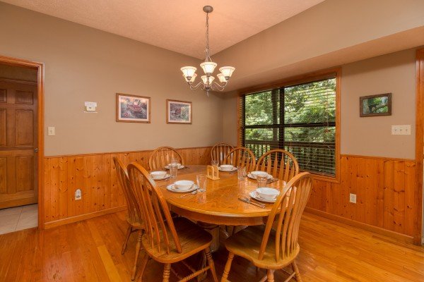 Dining table for six at Stones Throw, a 4 bedroom cabin rental located in Pigeon Forge
