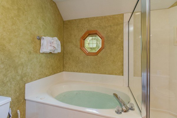 Jacuzzi in a bathroom at Stones Throw, a 4 bedroom cabin rental located in Pigeon Forge