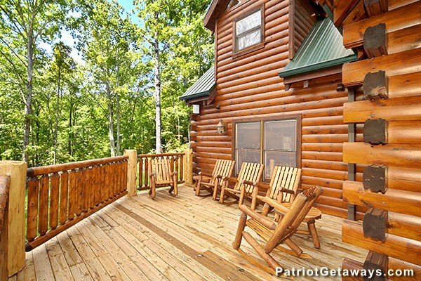 Adirondack chairs on the open deck Incredible! A 6 bedroom cabin rental located in Gatlinburg