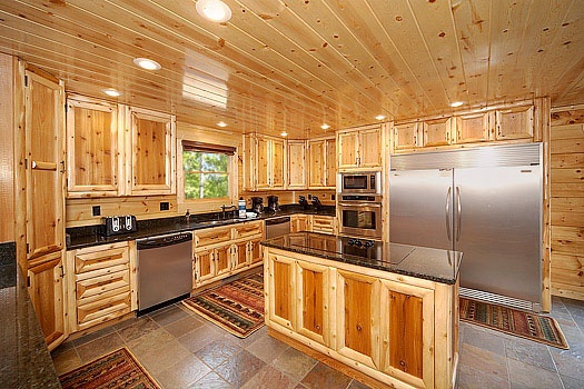 Large kitchen with over sized stainless appliances at Incredible! A 6 bedroom cabin rental located in Gatlinburg
