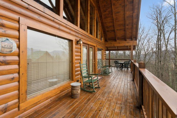 Deck with rocking chairs at Bootlegger's Bounty, a 1-bedroom cabin rental located in Pigeon Forge