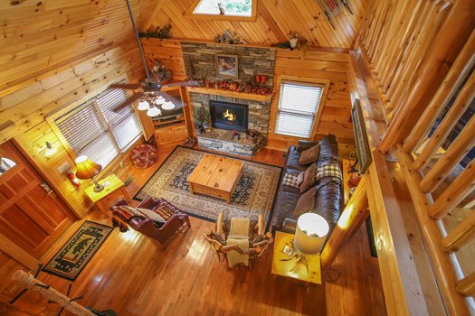 Looking down into the living room from the upper floor at Fox n' Socks, a 3-bedroom cabin rental located in Pigeon Forge
