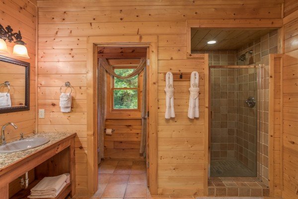 Bathroom with a vanity and shower at Laid Back, a 2 bedroom cabin rental located in Pigeon Forge