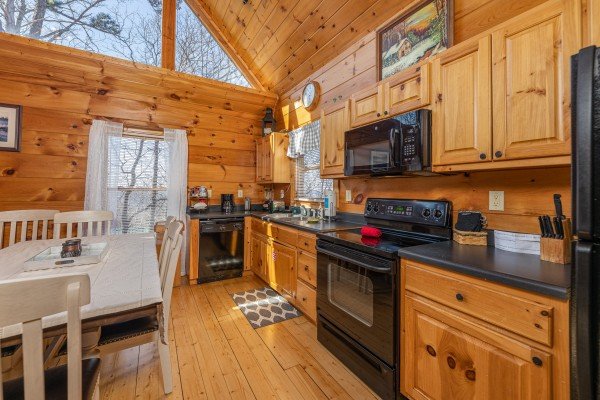 Kitchen with black appliances at Tip Top View, a 3 bedroom cabin rental located in Pigeon Forge