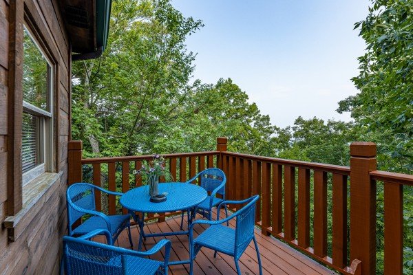 Outdoor dining for 4 at Tip Top View, a 3 bedroom cabin rental located in Pigeon Forge