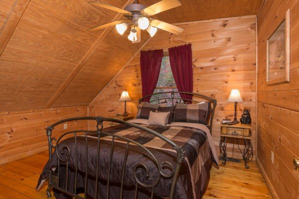 Bedroom with night stands and lamps at Lincoln Logs, a 2 bedroom cabin rental located in Gatlinburg