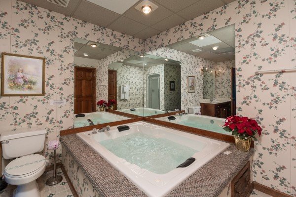 Jacuzzi in a bathroom at Ain't Misbehaven, a 1 bedroom cabin rental located in Pigeon Forge