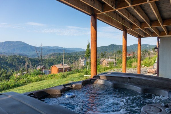 Hot tub with a mountain view at Splash Mountain Lodge a 4 bedroom cabin rental located in Gatlinburg