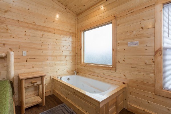 Jacuzzi in a bedroom at Splash Mountain Lodge a 4 bedroom cabin rental located in Gatlinburg