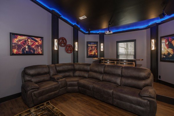 Seating in the theater room at Splash Mountain Lodge a 4 bedroom cabin rental located in Gatlinburg