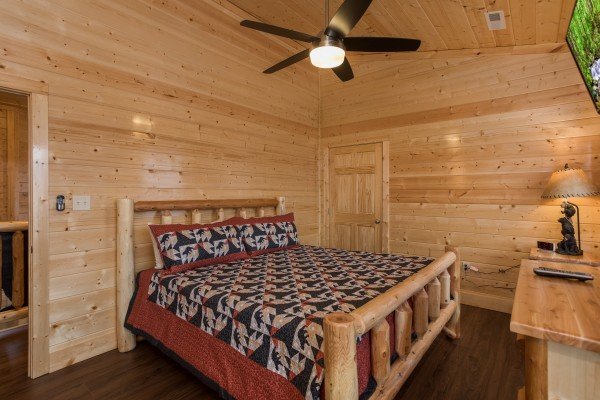 Bedroom with a log bed at Splash Mountain Lodge a 4 bedroom cabin rental located in Gatlinburg