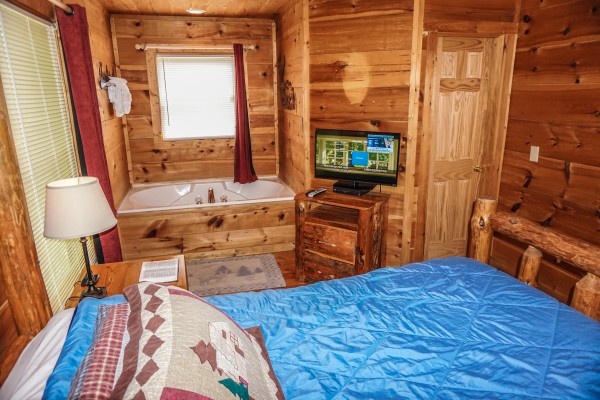 Jacuzzi in the bedroom at Deerly Beloved, a 1-bedroom cabin rental located in Gatlinburg