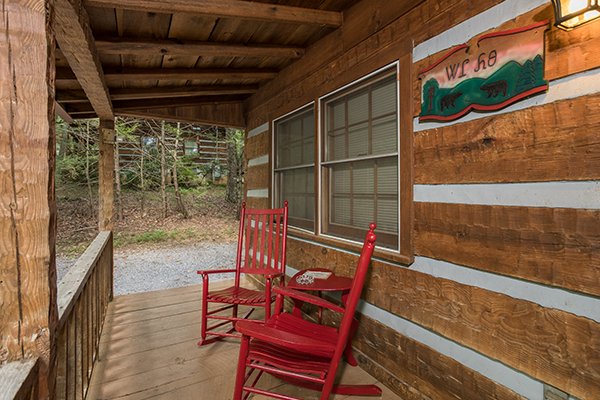 Rocking chairs on the covered front porch at Little Bear, a 1 bedroom cabin rental located in Pigeon Forge