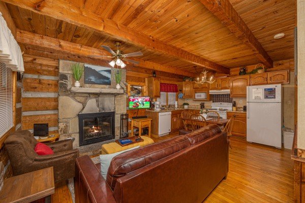 Living room and kitchen at Little Bear, a 1 bedroom cabin rental located in Pigeon Forge