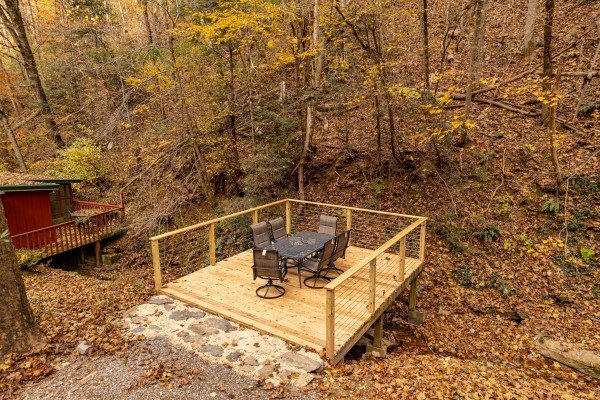 Outdoor dining for 6 at Creekside Dream, a 1 bedroom cabin rental located in Gatlinburg