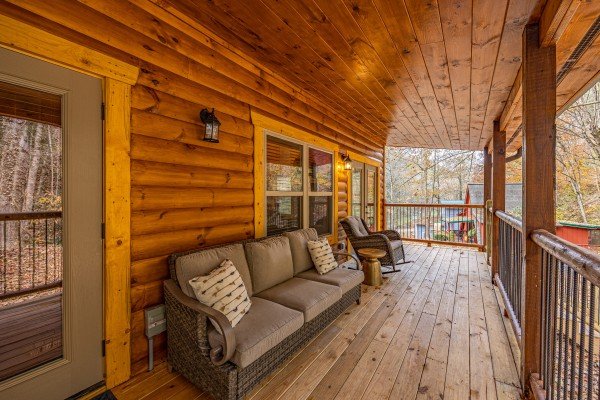 Porch seating at Creekside Dream, a 1 bedroom cabin rental located in Gatlinburg