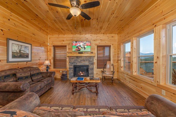 Fireplace and flat screen at The One With The View, a 4 bedroom cabin rental located in Pigeon Forge