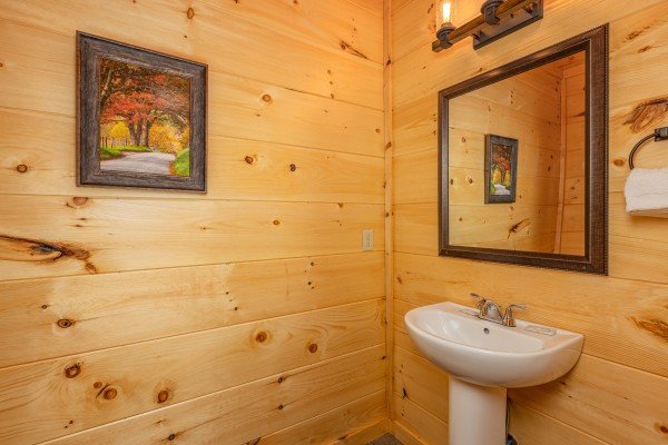 Half bath on the main floor at Heavenly Daze, a 4 bedroom cabin rental located in Pigeon Forge