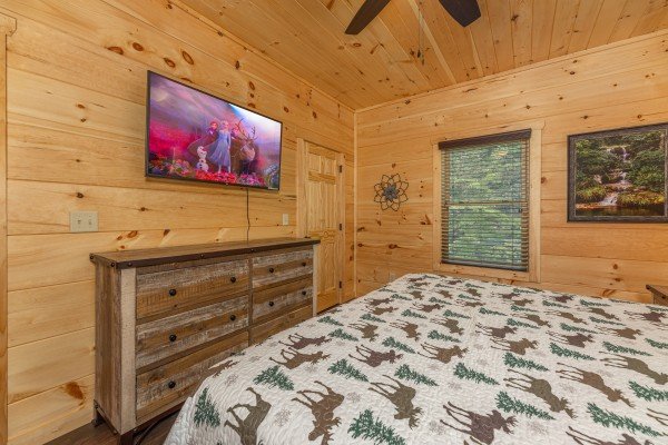 King bedroom TV at Heavenly Daze, a 4 bedroom cabin rental located in Pigeon Forge