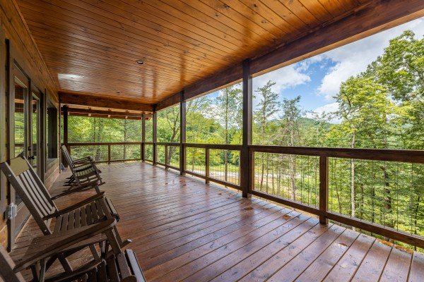 Main floor rocking chairs on the deck at Heavenly Daze, a 4 bedroom cabin rental located in Pigeon Forge