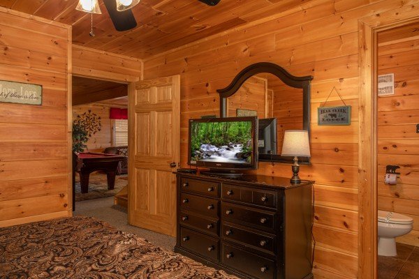 Dresser and TV in a bedroom at Better View, a 4 bedroom cabin rental located in Pigeon Forge