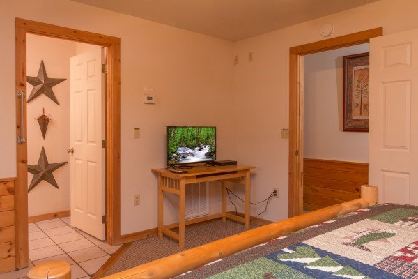 Bedroom with a TV at Just for Fun, a 4 bedroom cabin rental located in Pigeon Forge