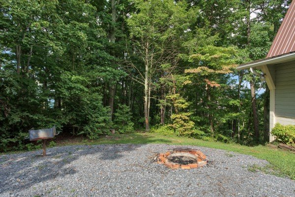 Fire pit and charcoal grill at Terrace Garden Manor, a 13 bedroom cabin rental located in Gatlinburg