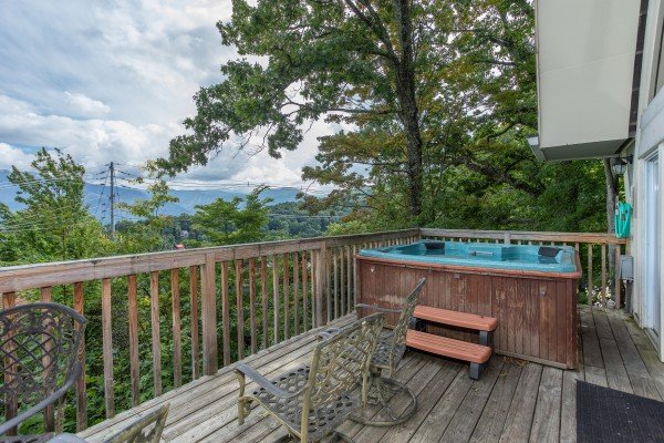 Hot tub on a deck at Terrace Garden Manor, a 13 bedroom cabin rental located in Gatlinburg