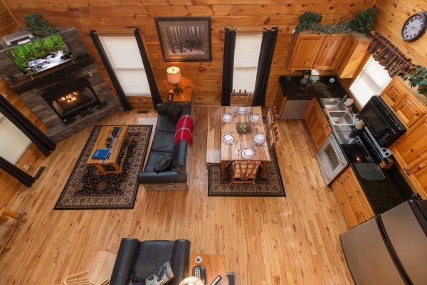 Looking down at the living room, dining space, and kitchen at Country Bear's Getaway, a 3-bedroom cabin rental located in Gatlinburg