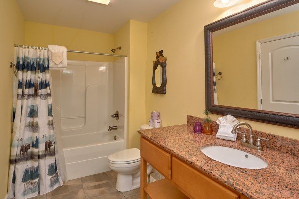 Bathroom with a tub and shower at River Dreamin', a 2 bedroom cabin rental located in Pigeon Forge
