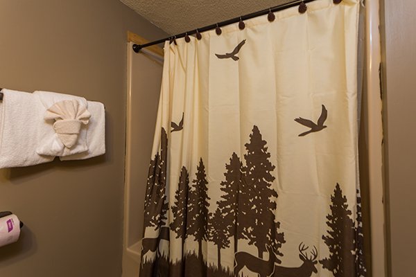 Bathroom with tub and shower at Soaring Heights, a 3 bedroom cabin rental located in Gatlinburg