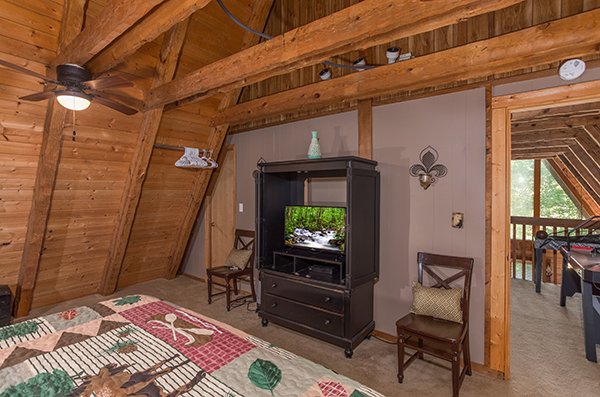 TV in an entertainment center console at Soaring Heights, a 3 bedroom cabin rental located in Gatlinburg