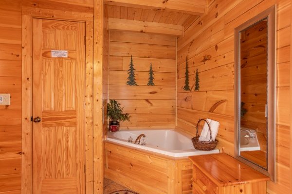 Corner jacuzzi tub at Bearfoot Memories, a 2-bedroom cabin rental located in Pigeon Forge