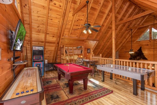 Game room loft at Bearfoot Memories, a 2-bedroom cabin rental located in Pigeon Forge