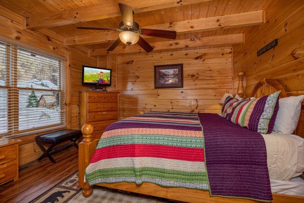 Bedroom with king bed and amenities at Bearfoot Memories, a 2-bedroom cabin rental located in Pigeon Forge