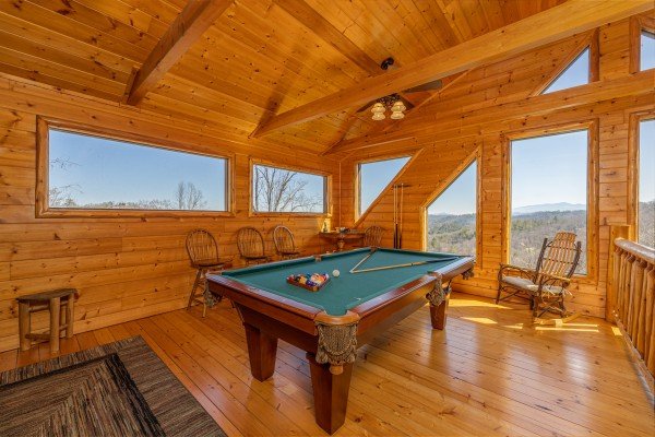 Pool table in the game loft at Mountain Adventure, a 2 bedroom cabin rental located in Pigeon Forge
