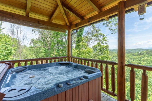 View from the hot tub on the covered porch at Mountain Adventure, a 2 bedroom cabin rental located in Pigeon Forge