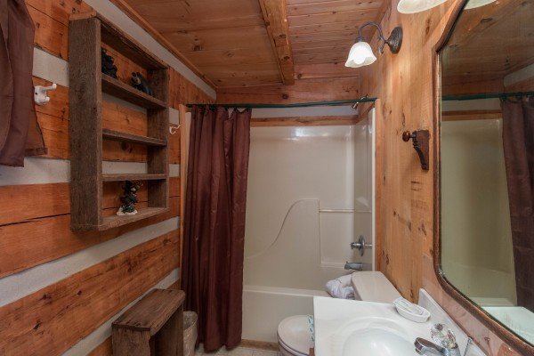Bathroom with a tub and shower at Mountain Glory, a 1 bedroom cabin rental located in Pigeon Forge