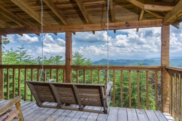 Porch swing and mountain view at Mountain Glory, a 1 bedroom cabin rental located in Pigeon Forge