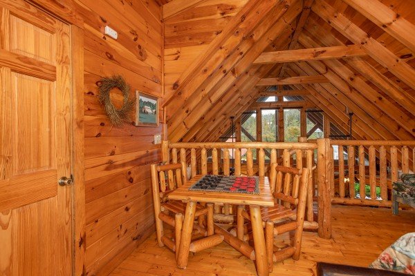 Checker table in the loft space at Granny D's, a 2 bedroom cabin rental located in Pigeon Forge
