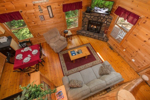 Looking down at the living room at Cabin Sweet Cabin, a 1 bedroom cabin rental located in Gatlinburg