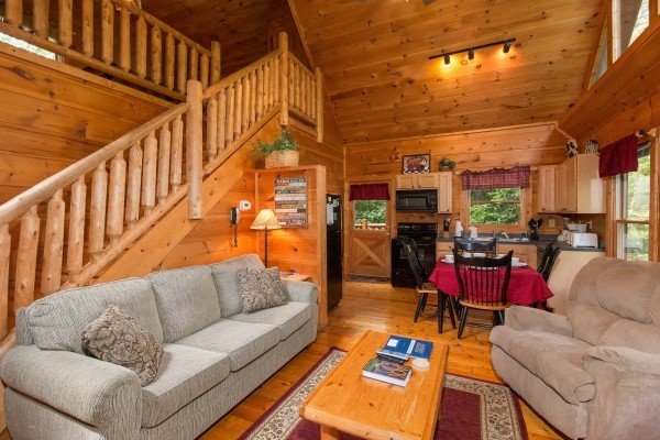 Sofa and chair in the living room at Cabin Sweet Cabin, a 1 bedroom cabin rental located in Gatlinburg