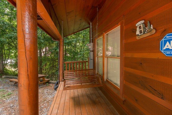 Porch swing at Cabin Sweet Cabin, a 1 bedroom cabin rental located in Gatlinburg